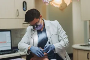The doctor with a patient during a procedure